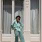 Pantalone a palazzo verde acqua con elastico e piping a contrasto